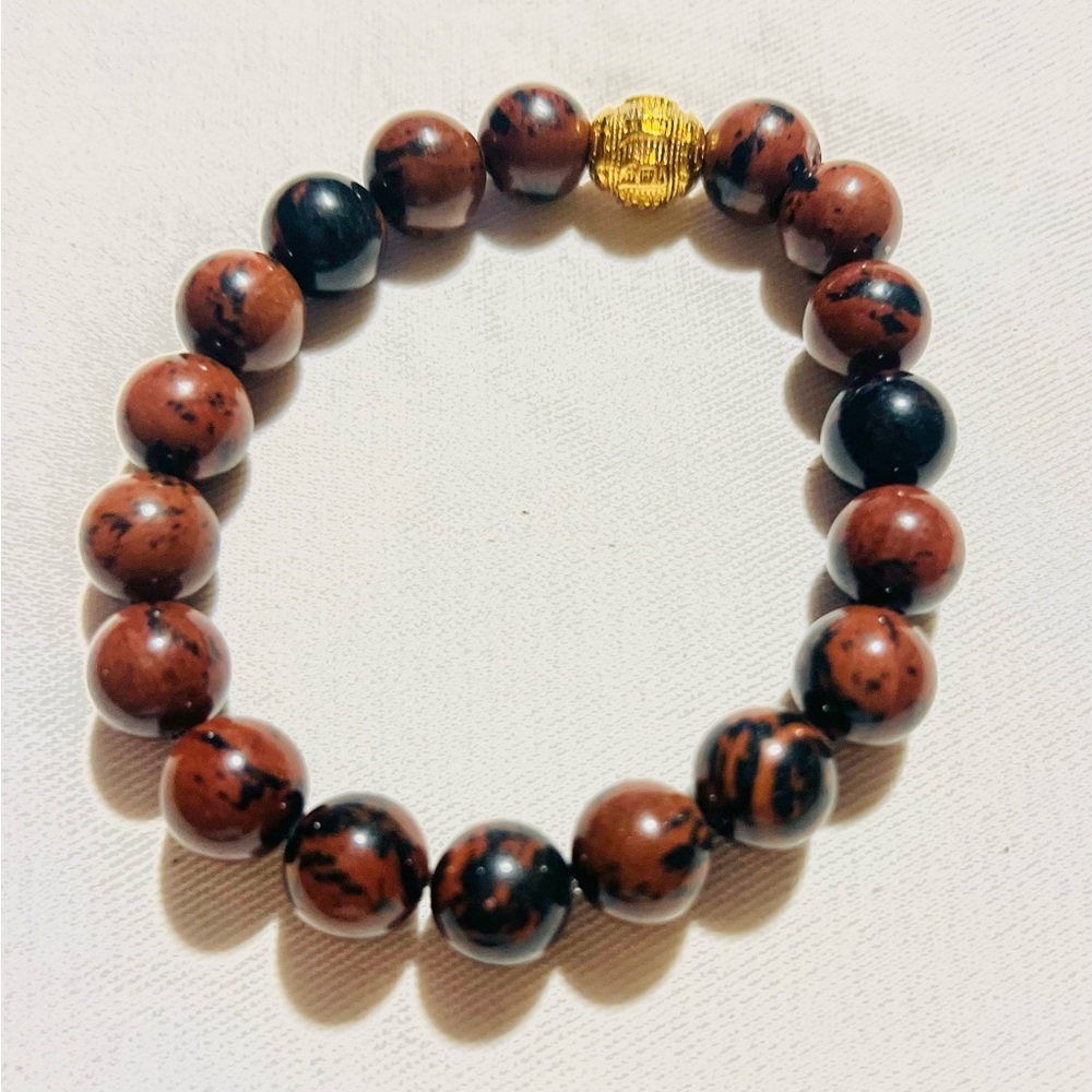 Obsidian stone crystal bracelet 

used for personal empowerment and healing.